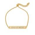 Gold bracelet with 'DAD & MOM' engraving on a white background