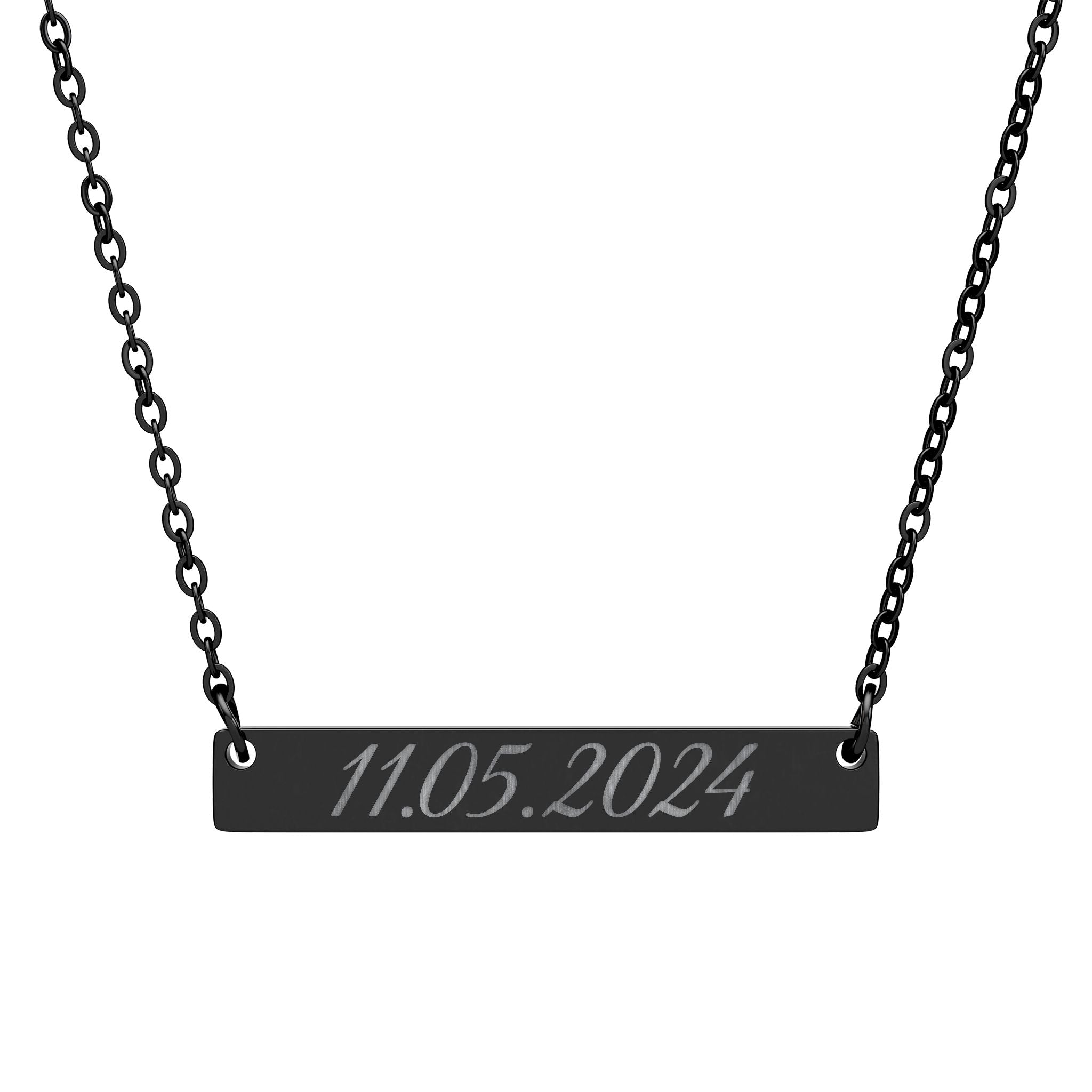Black bar necklace with engraved date on a white background