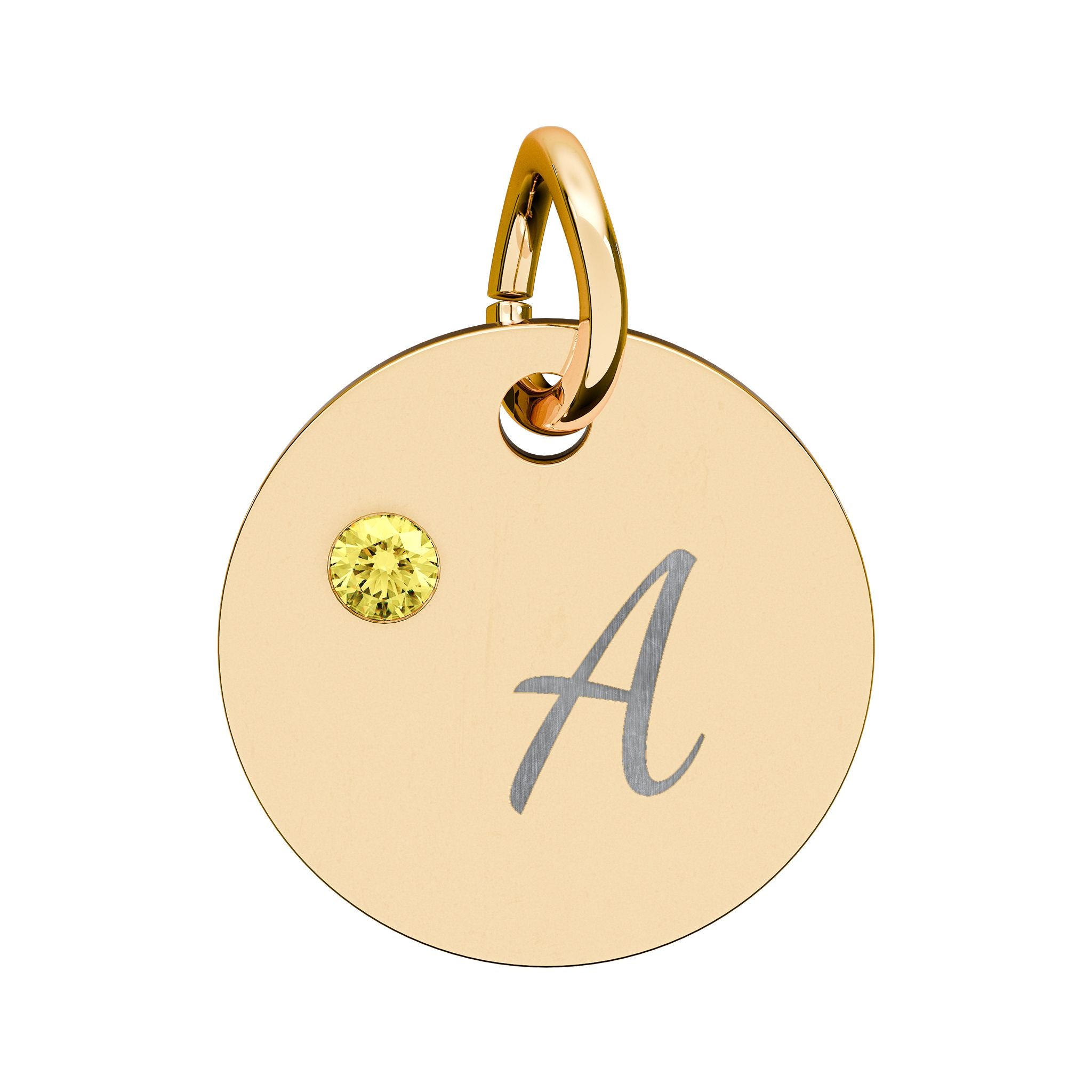 Gold pendant with letter 'A' and yellow gemstone on a white background