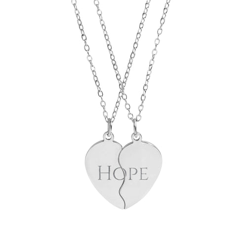 Silver necklace with two heart-shaped pendants on a white background
