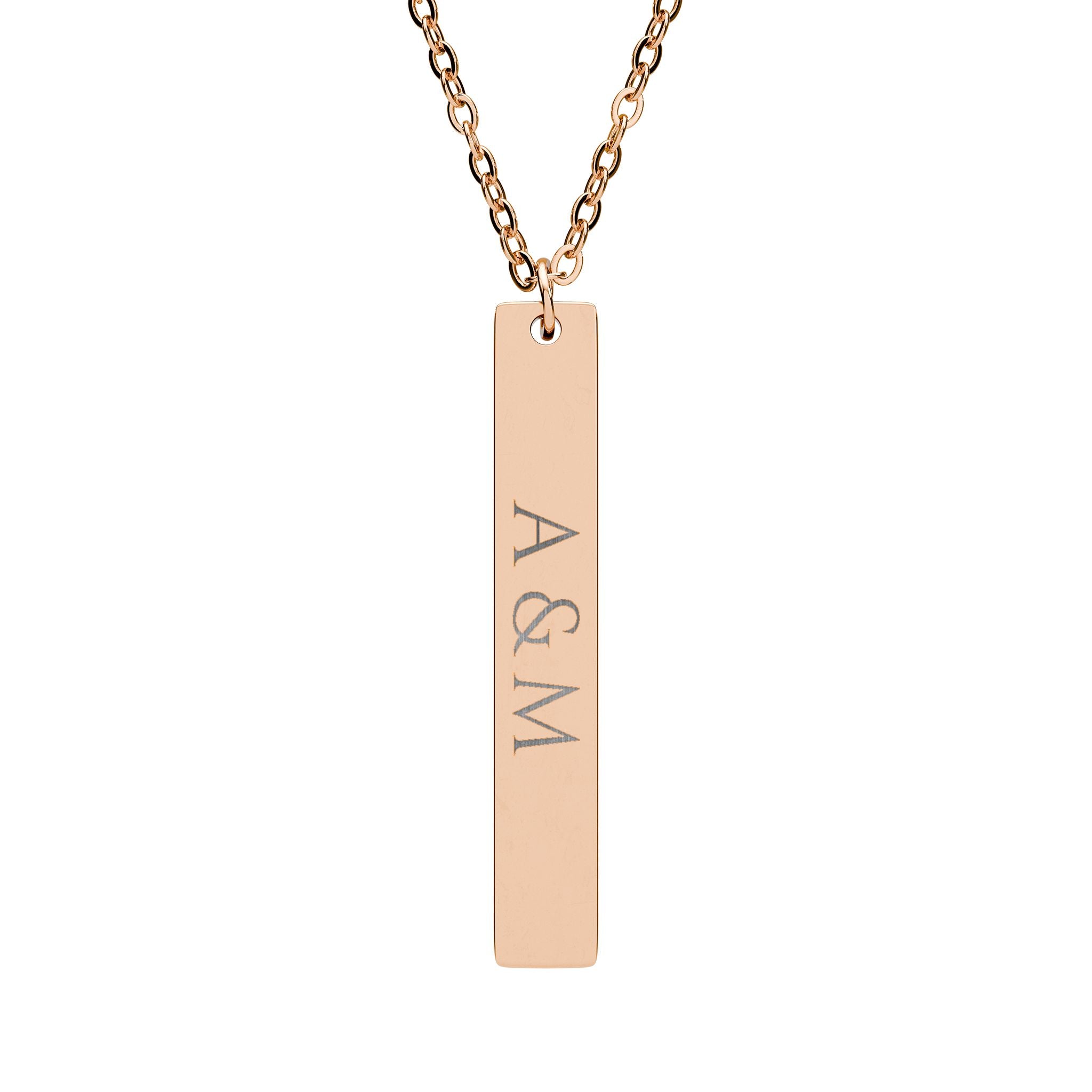 Gold necklace with a bar pendant inscribed with 'A & M' on a white background