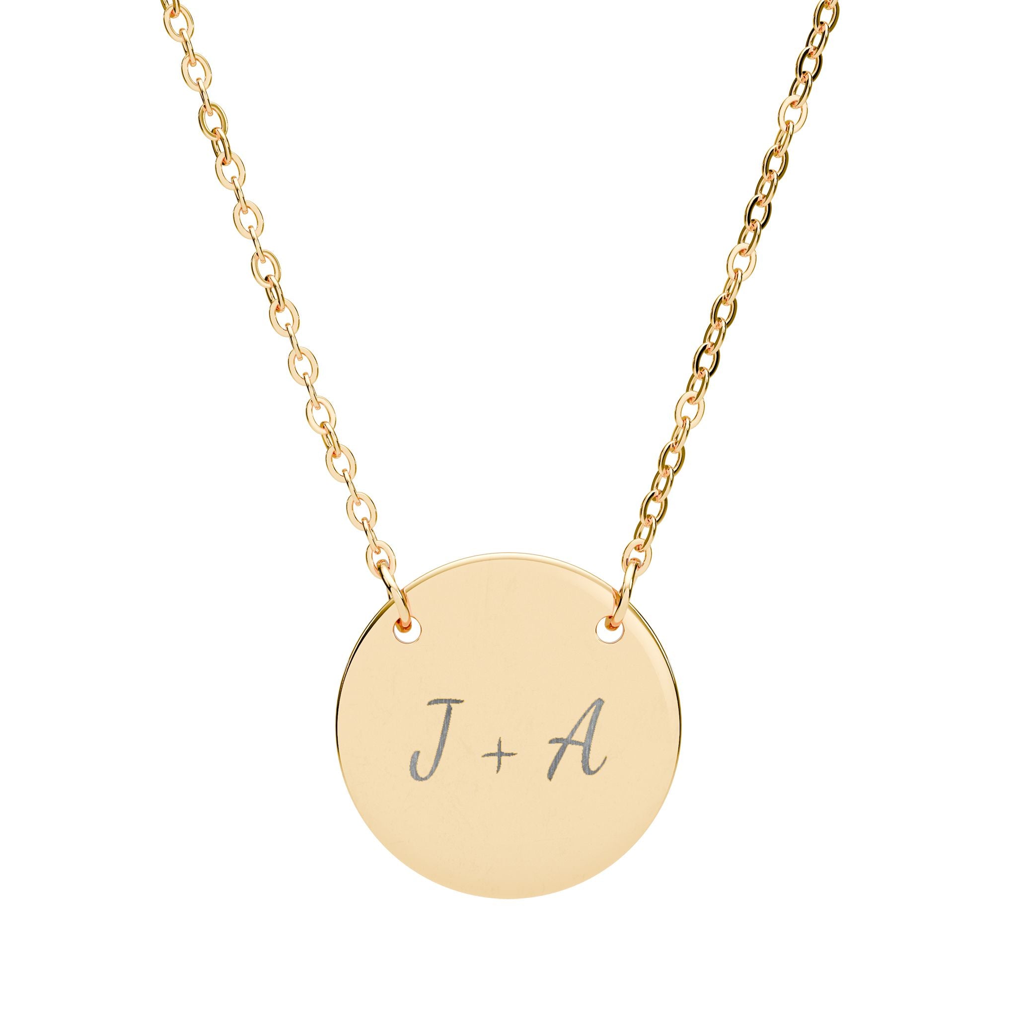 Gold necklace with a round pendant featuring initials on a white background